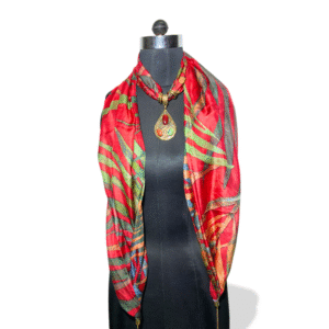 Red silk stole with green leaf pattern and earthy tone pendant